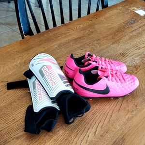 Bright pink Nike soccer cleats 12c and shin guards